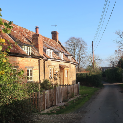 Photo of sunny country village lane