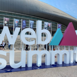 Web Summit logo standing outside venue