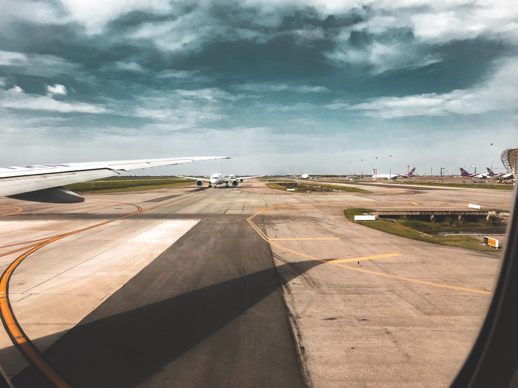 Photo of runway with aeroplanes 