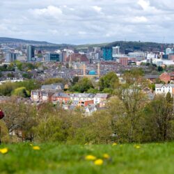 Sheffield skyline. Foreground of field and child