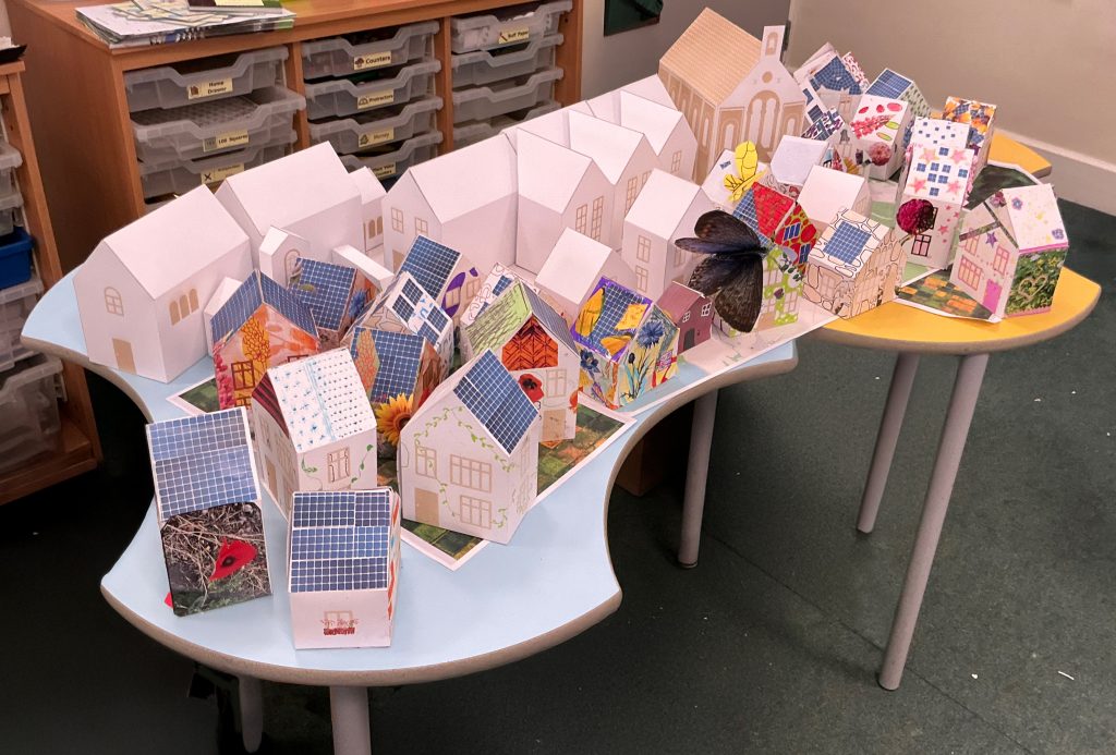 Paper model houses made during a school workshop.