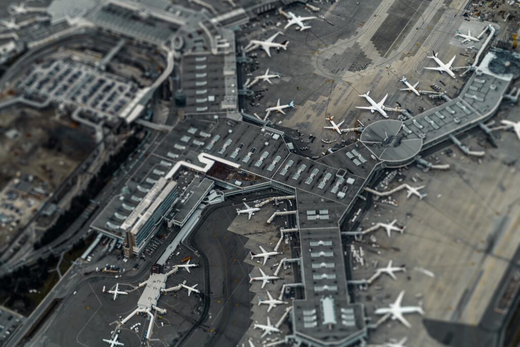 Aerial view of an airport with aeroplanes at gates